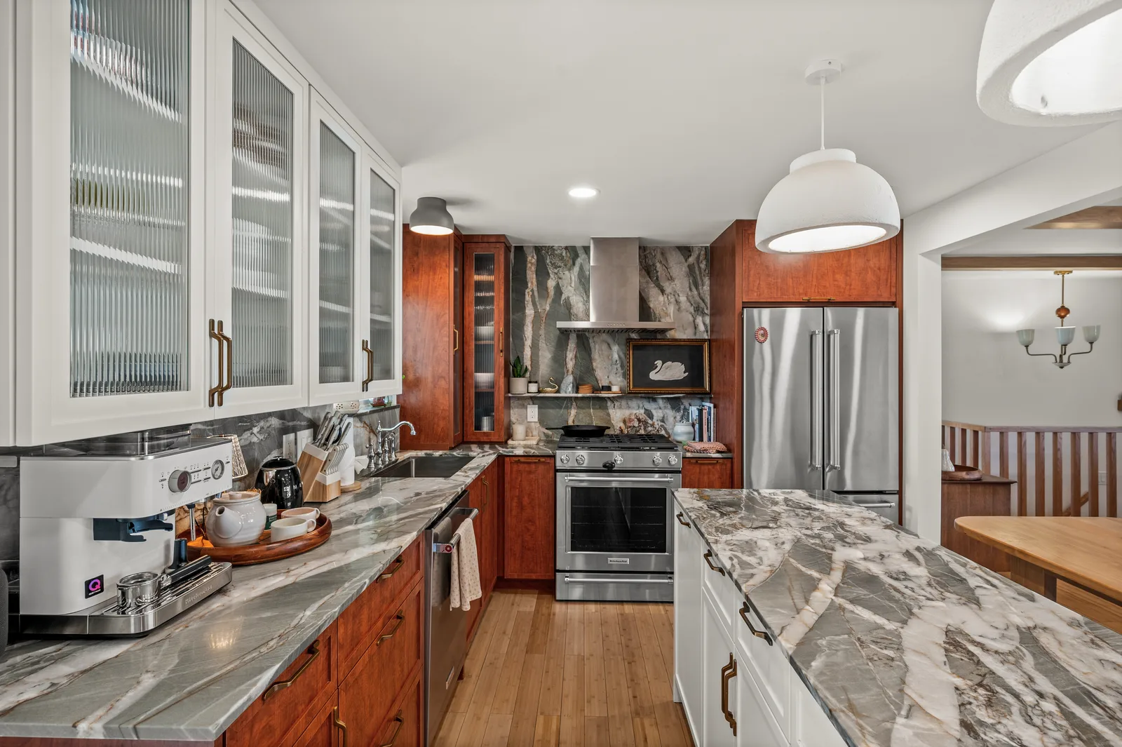 Custom kitchen with a stone island and custom millwork in a Holladay Utah remodel by Citizen Builders